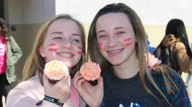 girls with pink cupcakes